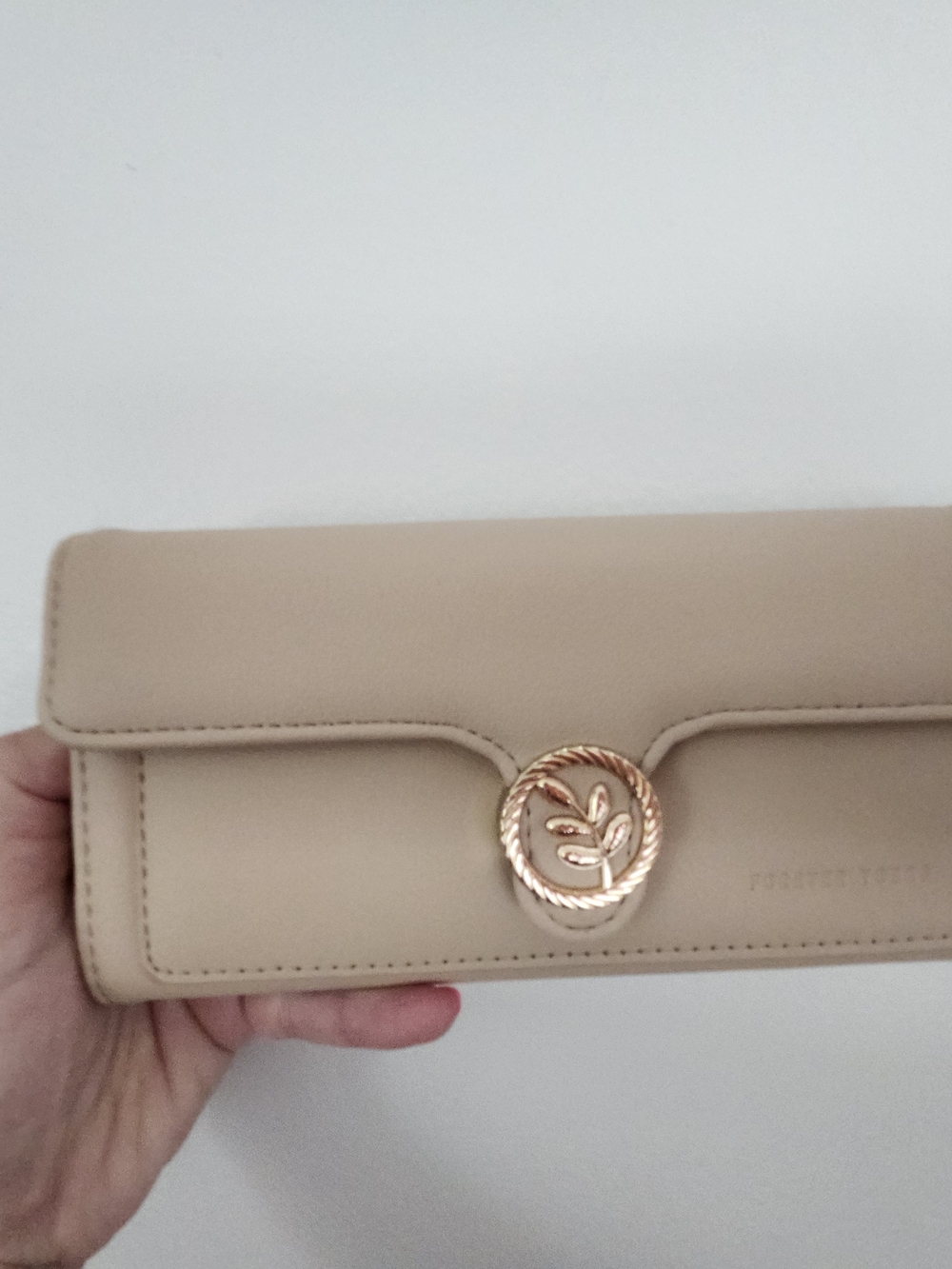 Cream Leather Clutch Wallet with Gold Medallion Accent